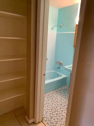 a bathroom with a sink toilet and mirror