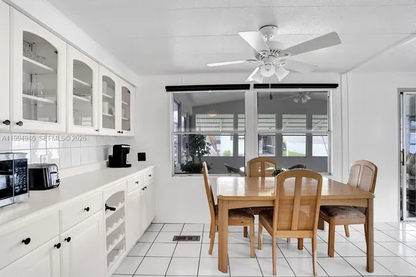 a view of a dining room with furniture and window