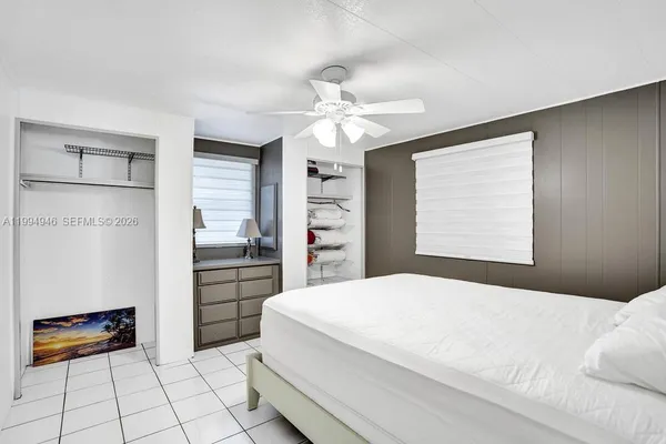 a bedroom with a bed and a walk in closet