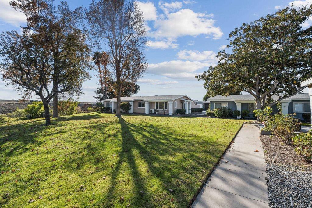 3757 Dearborn Street Oceanside, CA 92057 - Photo 28 of 33 a front view of a house with a yard