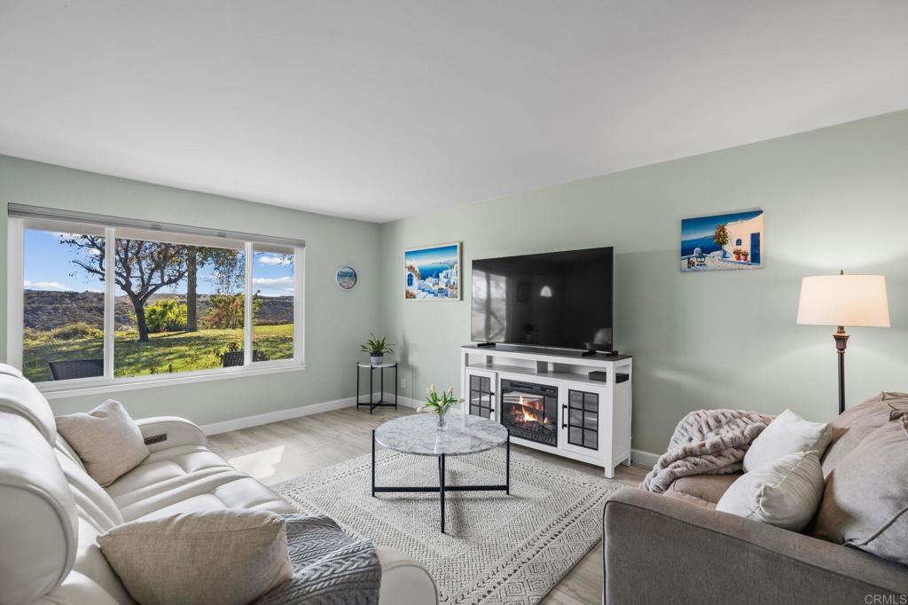3757 Dearborn Street Oceanside, CA 92057 - Photo 8 of 33 a living room with furniture and a flat screen tv