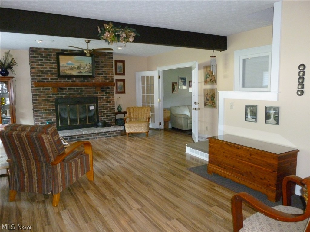 2020 Liberty Road Stow, OH 44224 - Photo 11 of 30 View into spacious living room with gas fireplace and media room addition with french doors