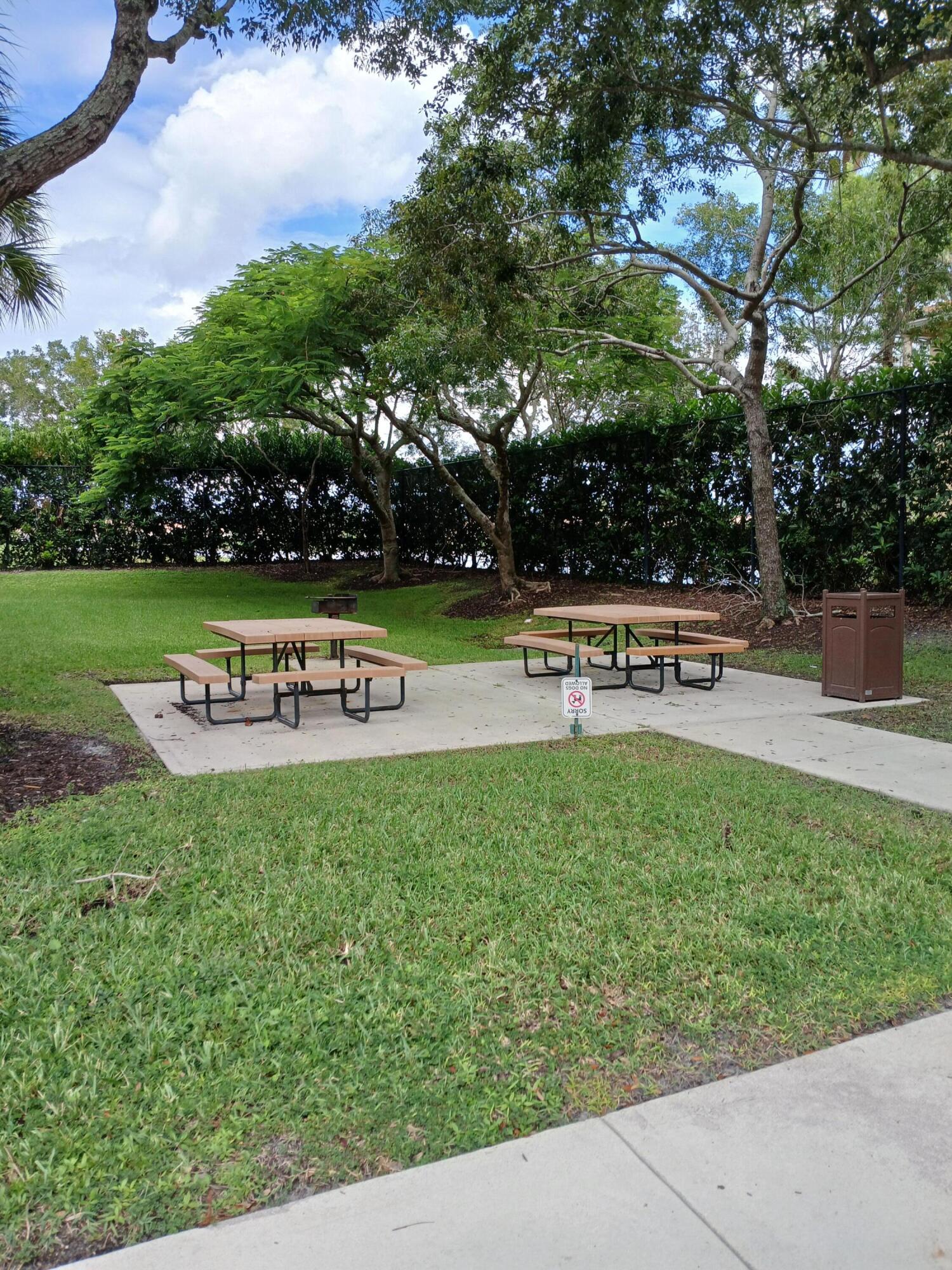 9857 Baywinds Boulevard, Unit 9212 Royal Palm Beach, FL 33411 - Photo 11 of 23 a view of a house with a yard