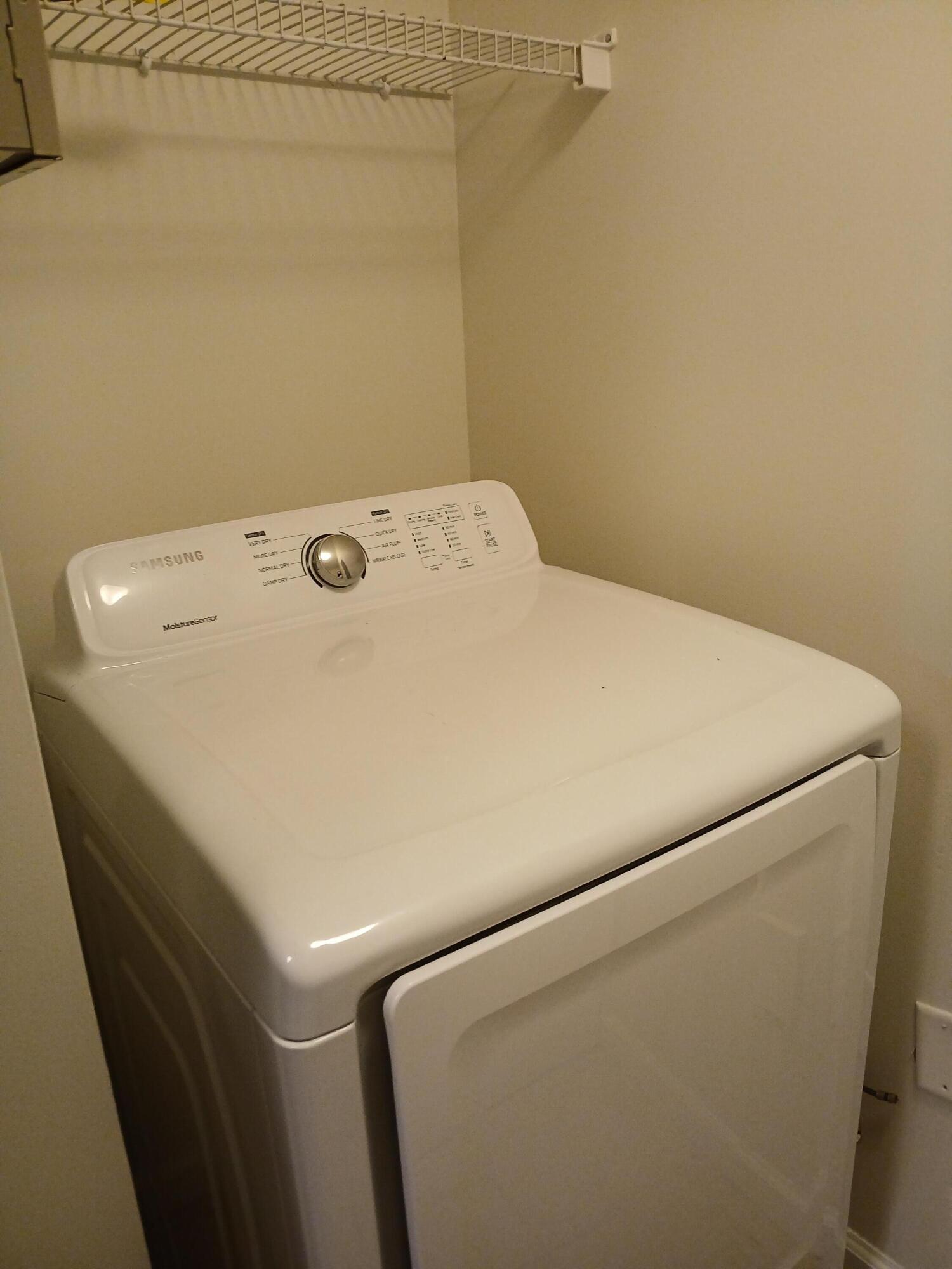 9857 Baywinds Boulevard, Unit 9212 Royal Palm Beach, FL 33411 - Photo 12 of 23 a close up view of washer and dryer