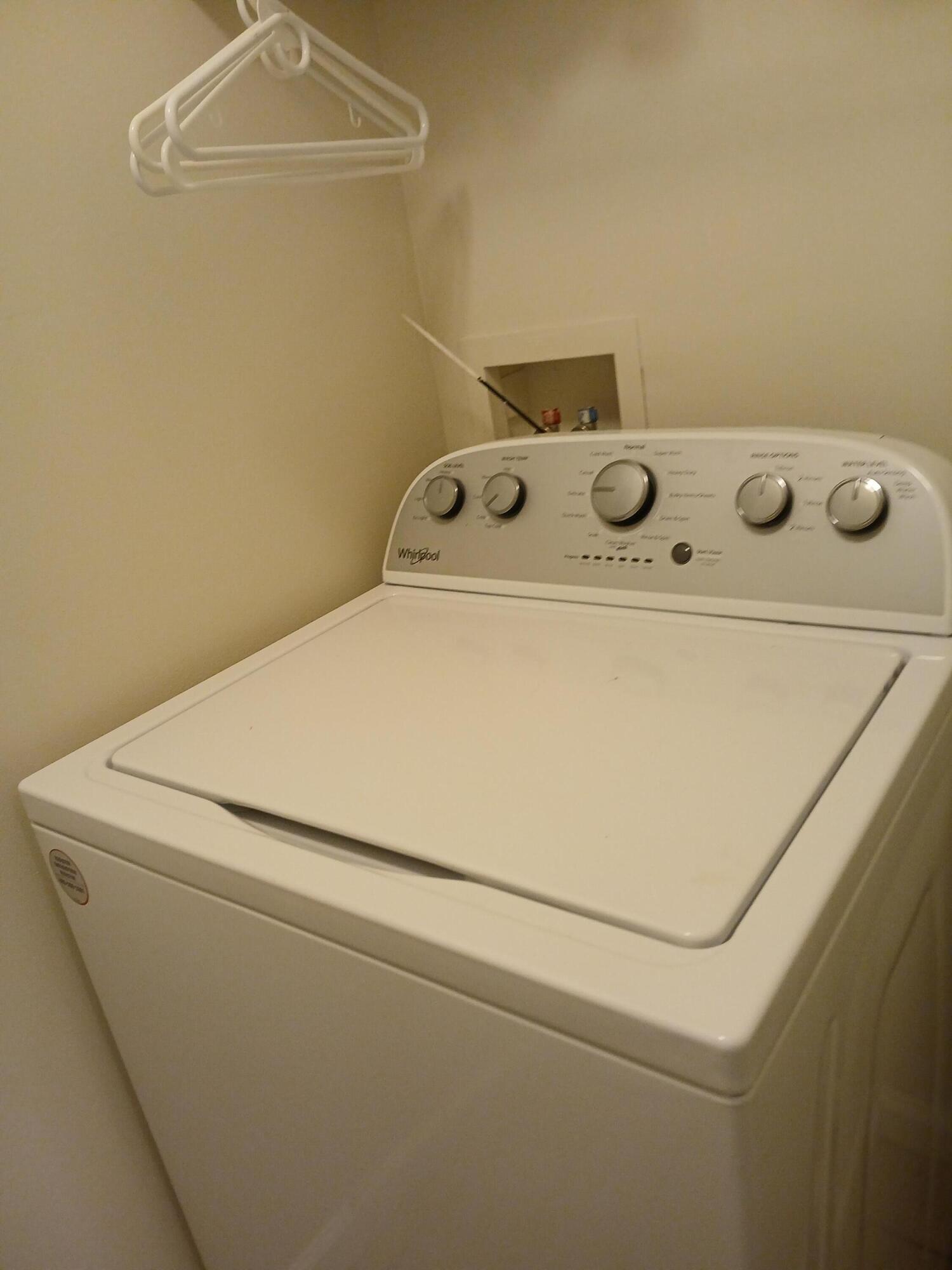 9857 Baywinds Boulevard, Unit 9212 Royal Palm Beach, FL 33411 - Photo 13 of 23 a utility room with dryer and washer