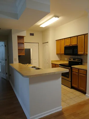 a kitchen with stainless steel appliances a stove and a refrigerator