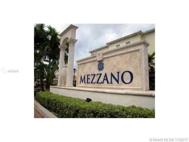 a view of outdoor space with signage and flags