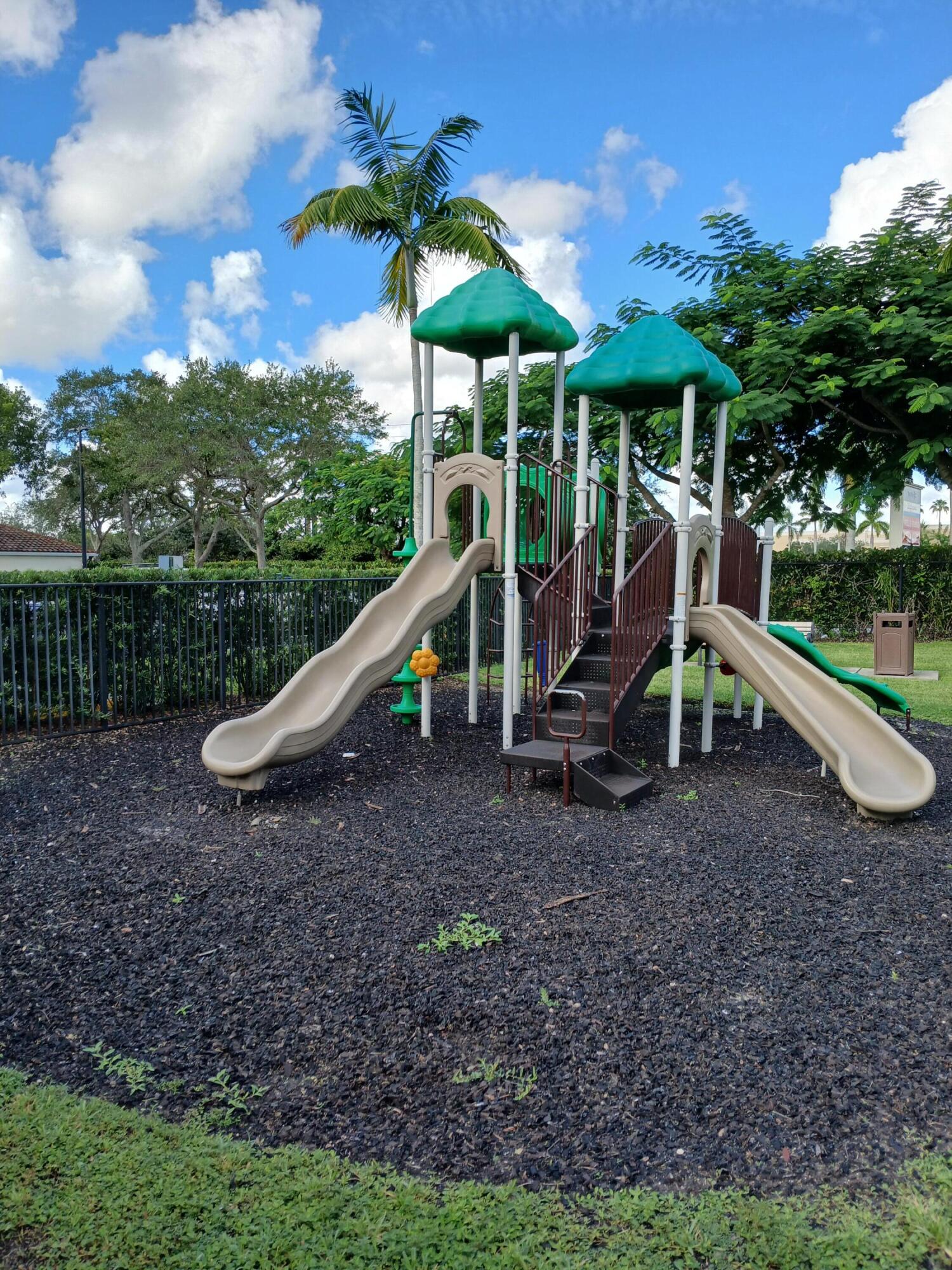 9857 Baywinds Boulevard, Unit 9212 Royal Palm Beach, FL 33411 - Photo 10 of 23 a view of a park with a slide