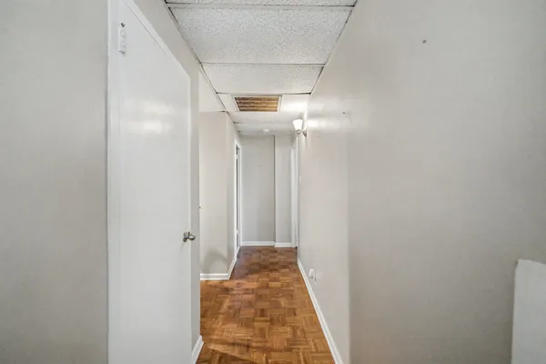 a view of a hallway with a white walls