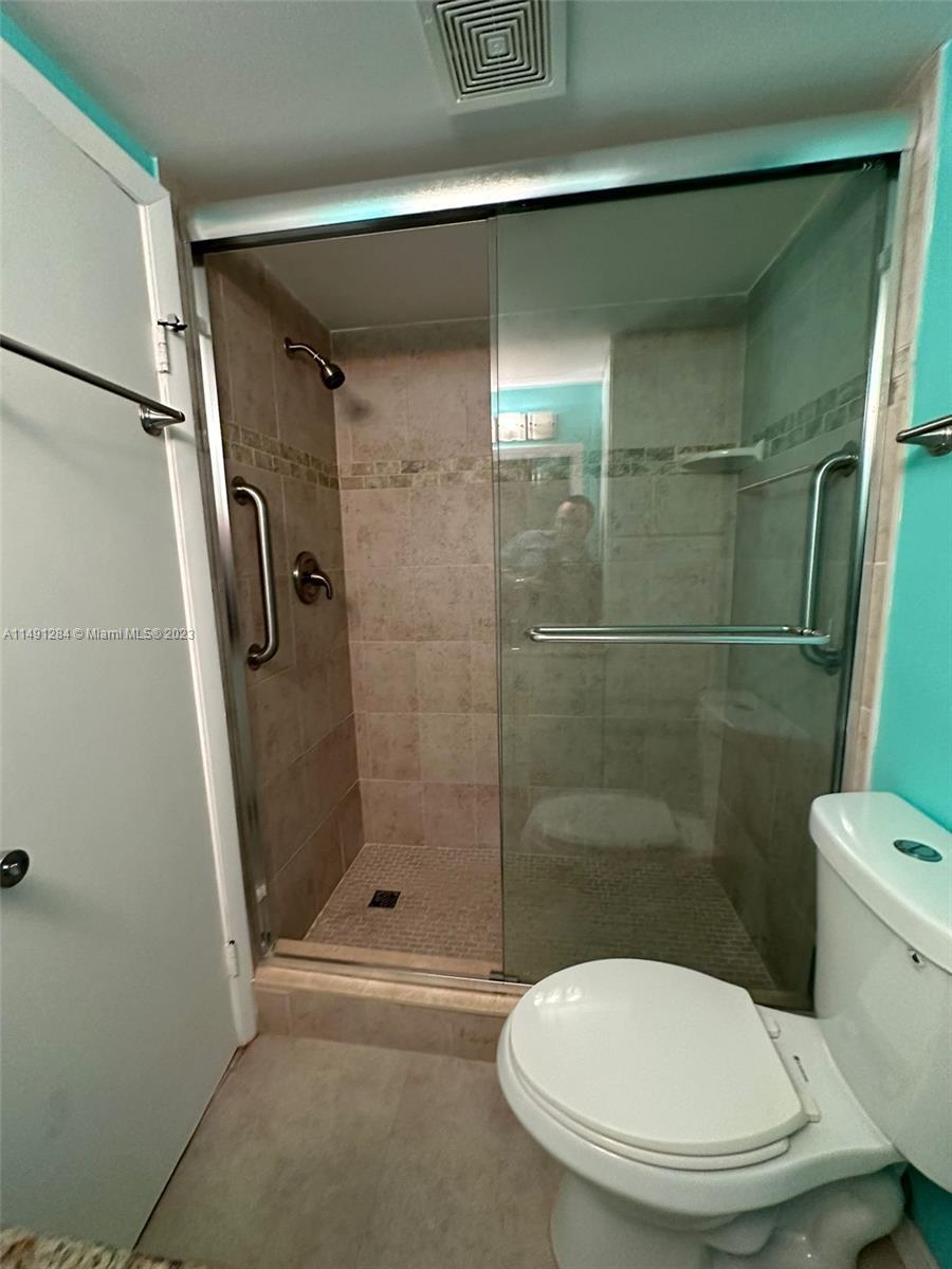 Arrowhead Condominium Davie, FL 33324 - Photo 8 of 23 a white toilet sitting next to a bathroom sink