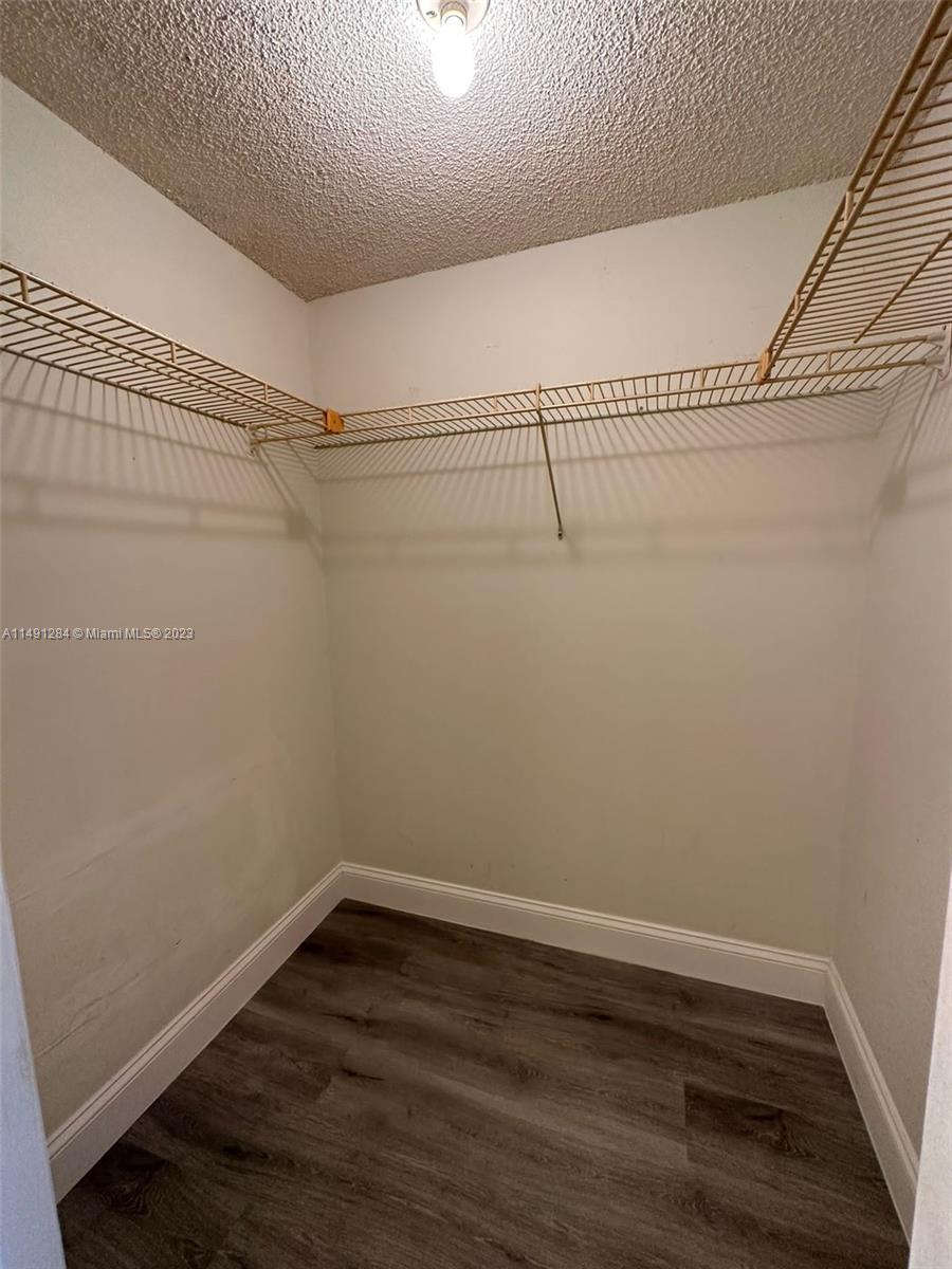 Arrowhead Condominium Davie, FL 33324 - Photo 9 of 23 a view of a room with racks on the wall