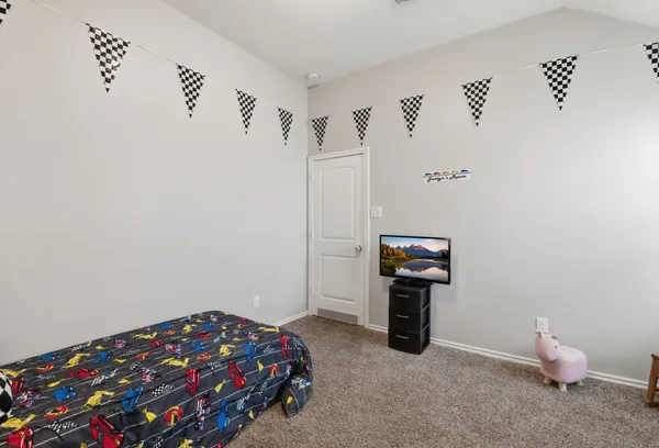 a bedroom with bed and window
