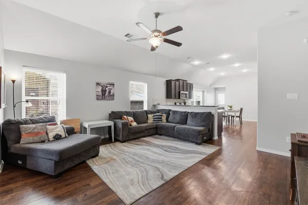 a living room with furniture and a large window