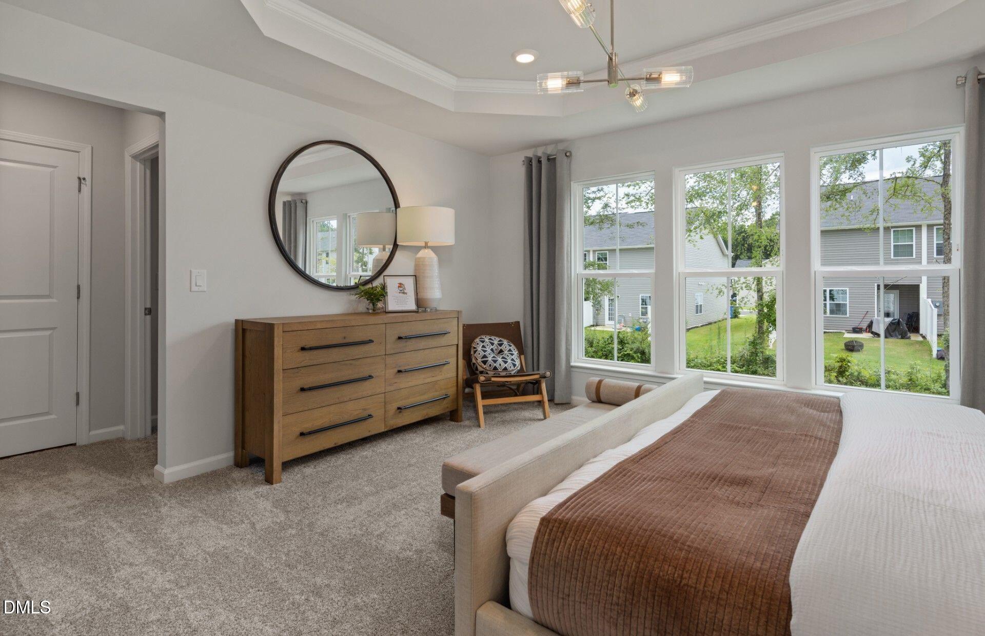 230 Broomside Avenue Raleigh, NC 27603 - Photo 21 of 25 a bed room with a bed mirror and a window