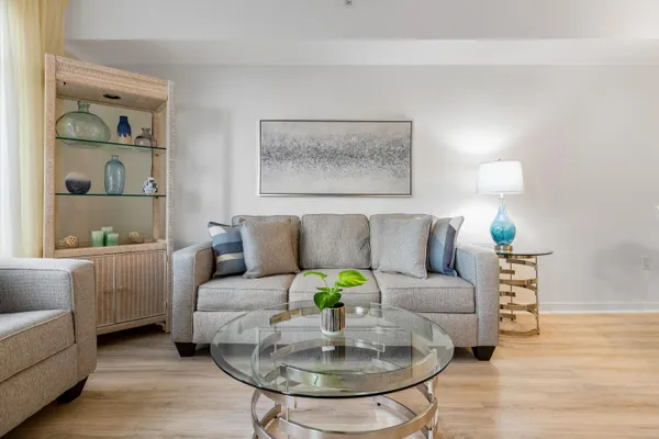 a living room with furniture and a lamp