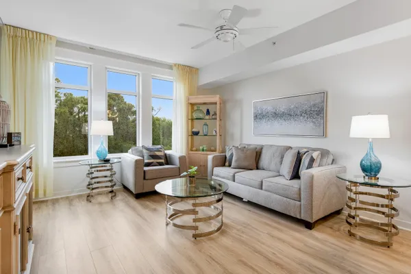 a living room with furniture and a large window