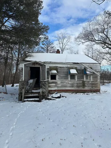 a front view of a house with parking space
