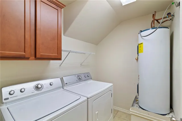 an empty room with closet and fan