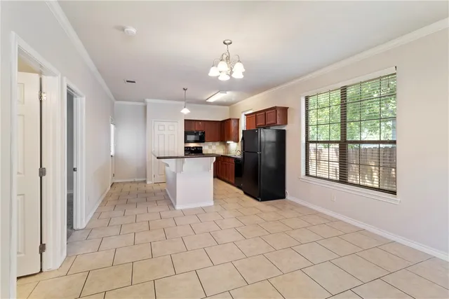 a view of a kitchen with windows