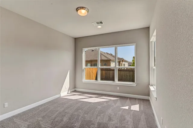 a bathroom with a granite countertop shower a mirror and a sink