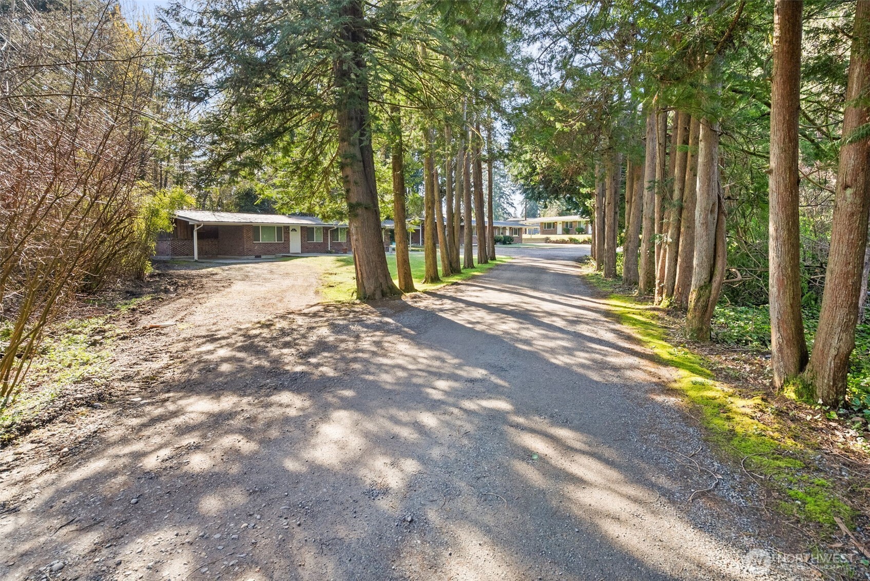 1000 Creso Road South Spanaway, WA 98387 - Photo 29 of 40 a backyard of a house with table and chairs