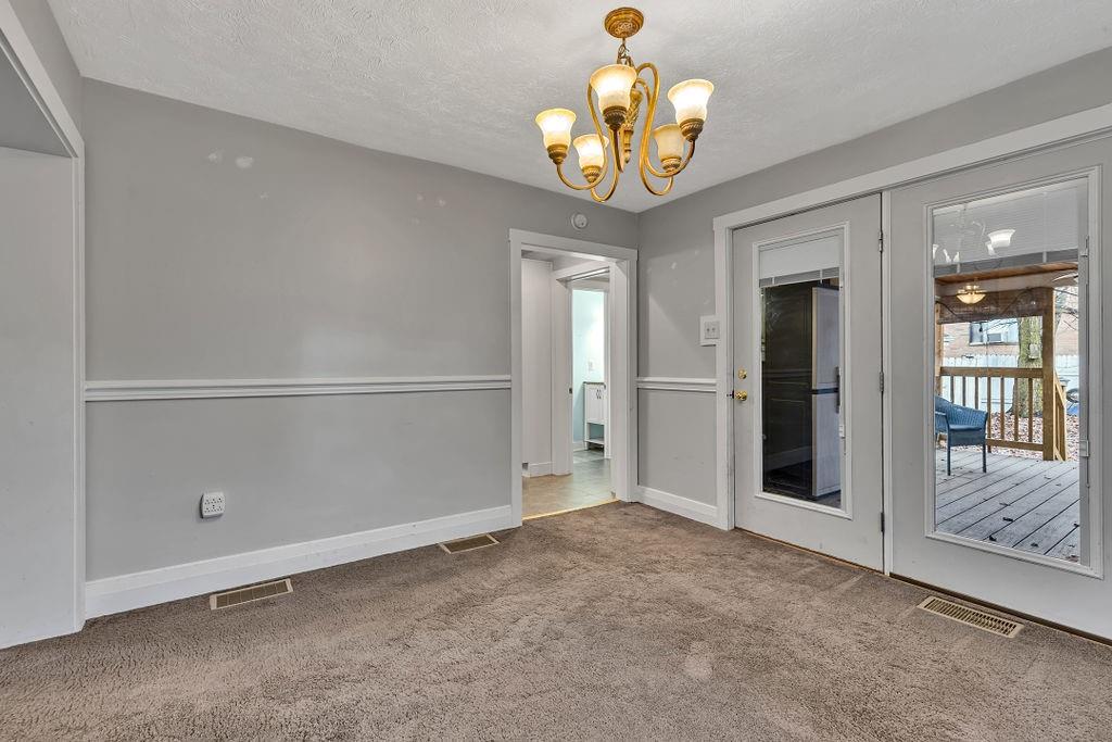 338 Buffalo Street Beaver, PA 15009 - Photo 8 of 21 a view of an empty room with a chandelier