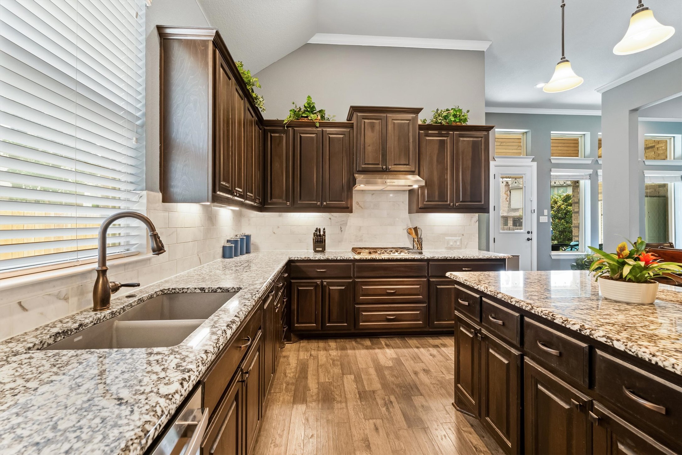1004 Hezekiah Lane Leander, TX 78641 - Photo 12 of 36 a kitchen with a sink and a stove top oven