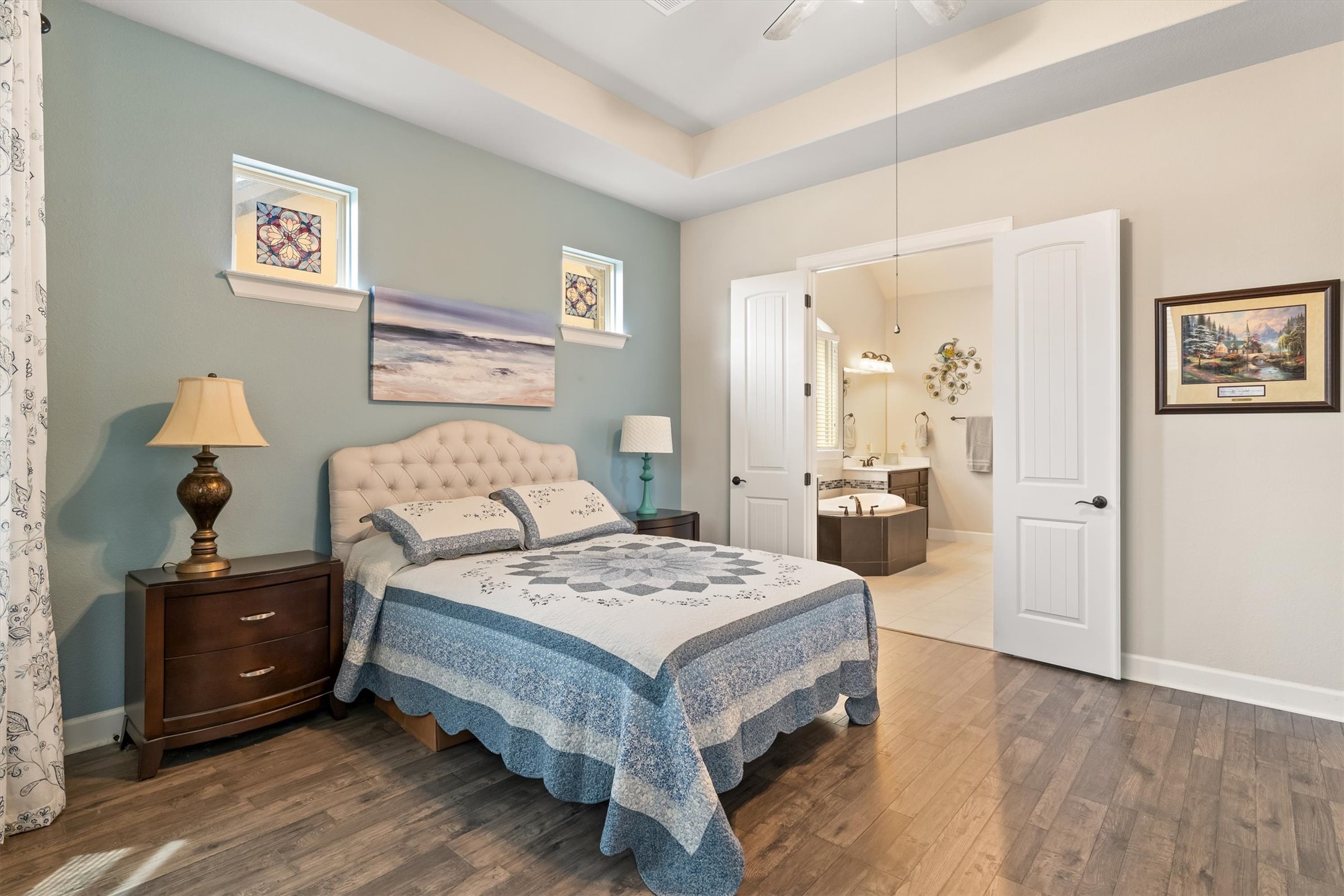 1004 Hezekiah Lane Leander, TX 78641 - Photo 17 of 36 a bedroom with a bed and a chandelier