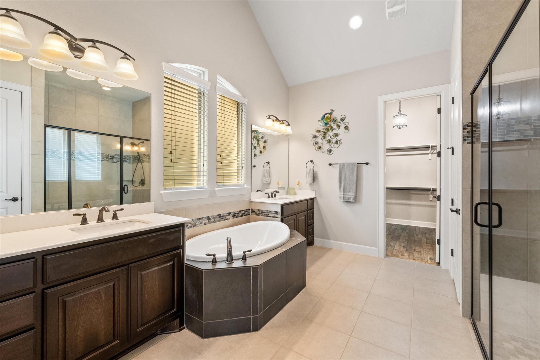 1004 Hezekiah Lane Leander, TX 78641 - Photo 18 of 36 a spacious bathroom with a tub sink shower and mirror