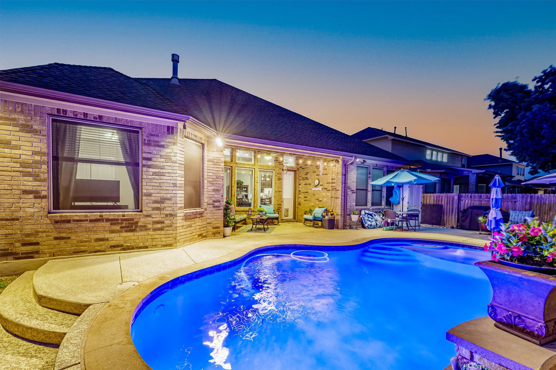 1004 Hezekiah Lane Leander, TX 78641 - Photo 2 of 36 a swimming pool with outdoor seating