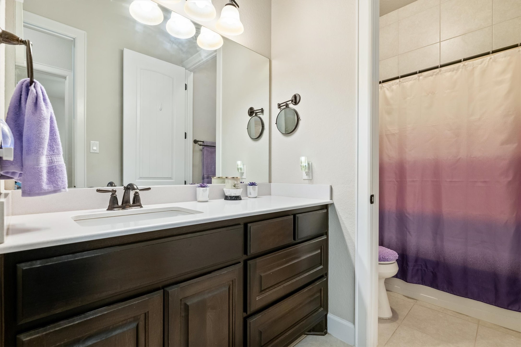 1004 Hezekiah Lane Leander, TX 78641 - Photo 26 of 36 a bathroom with a double vanity sink and a mirror