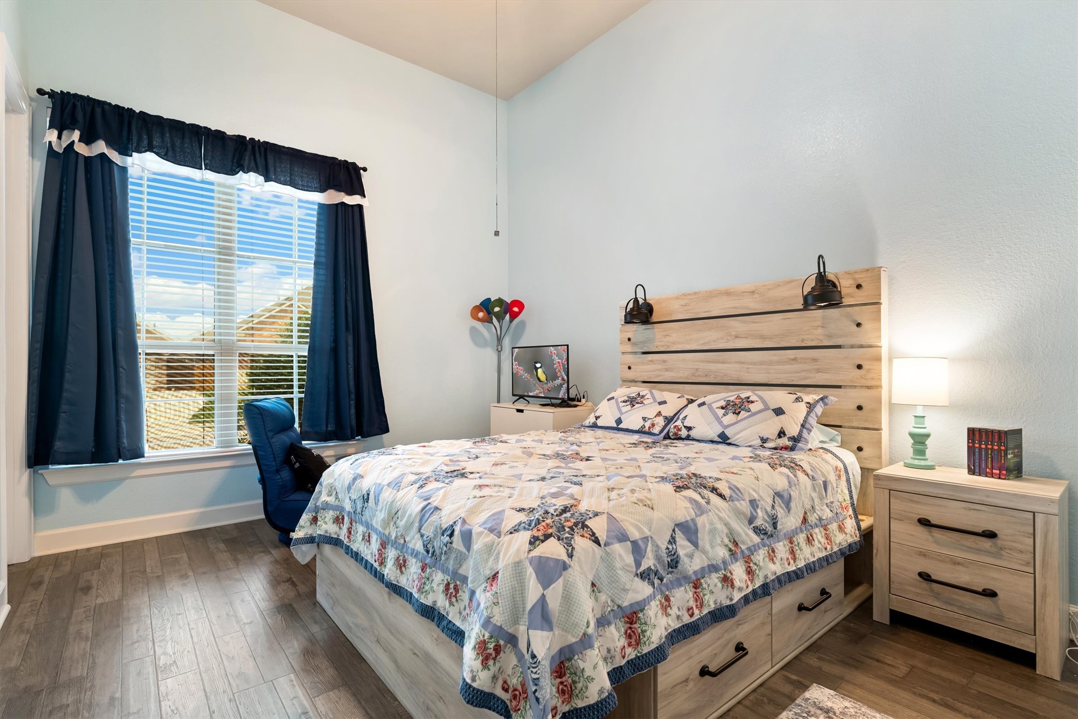 1004 Hezekiah Lane Leander, TX 78641 - Photo 27 of 36 a bedroom with a bed and wooden floor