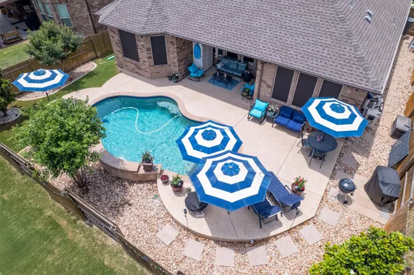 a view of a chairs and tables in the patio