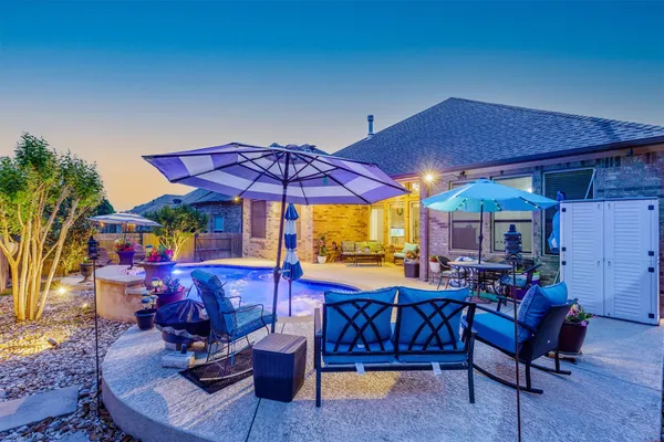 a view of swimming pool with outdoor seating