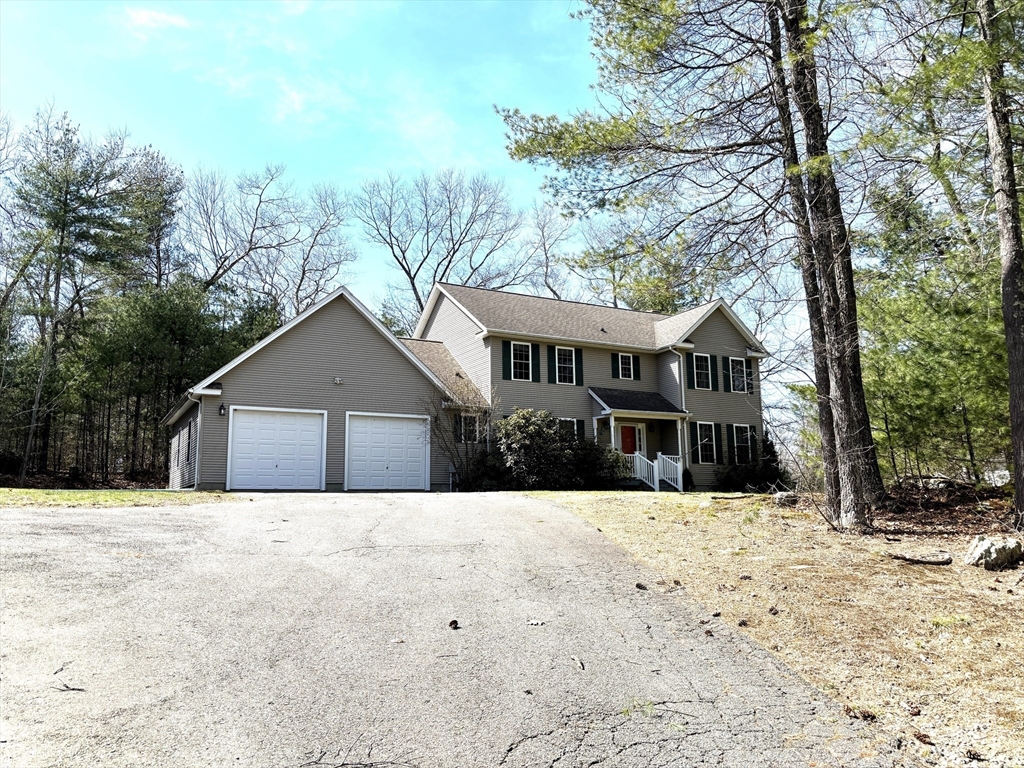 86 Coffey Hill Road Ware, MA 01082 - Photo 4 of 34 a front view of a house with a yard covered in snow