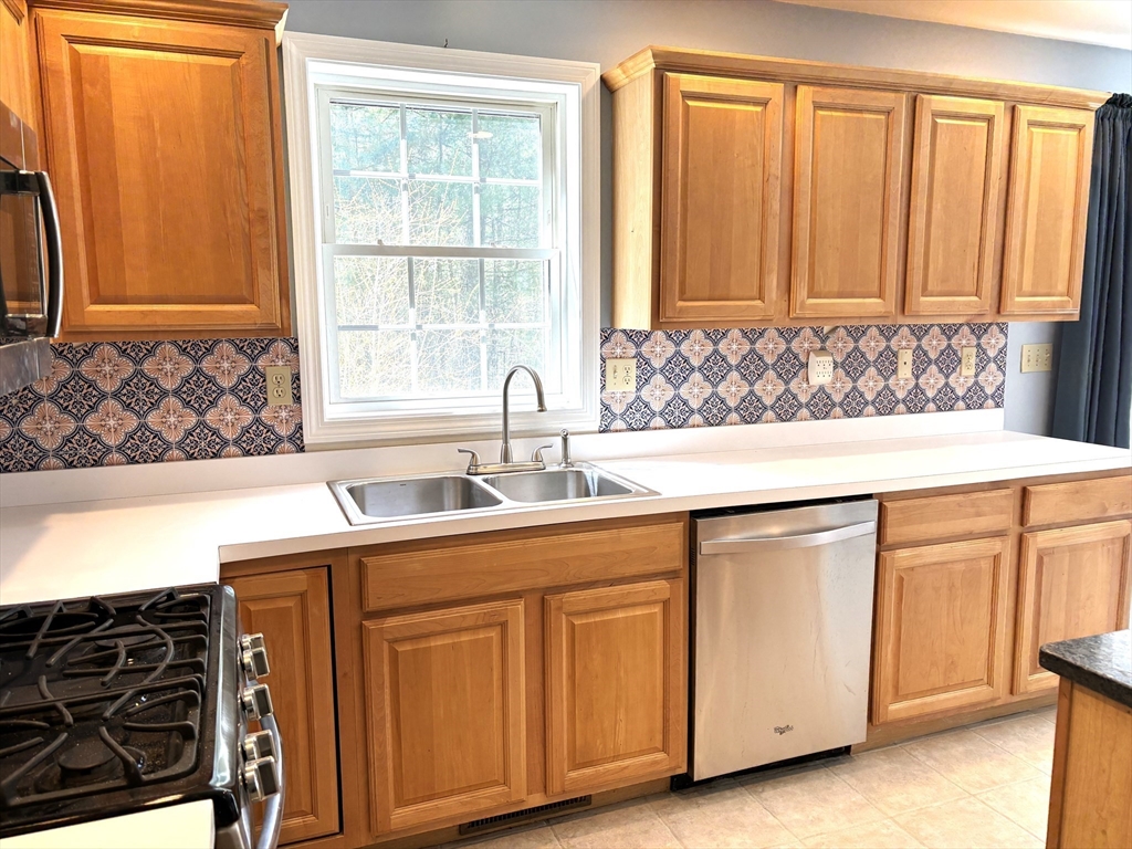 86 Coffey Hill Road Ware, MA 01082 - Photo 7 of 34 a kitchen with a sink and cabinets