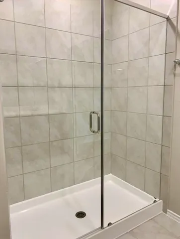 a bathroom with a shower and a bathtub