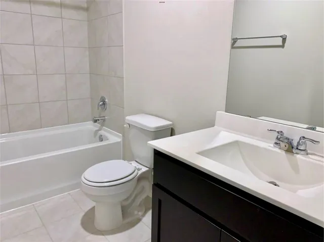 a bathroom with a sink toilet and bathtub