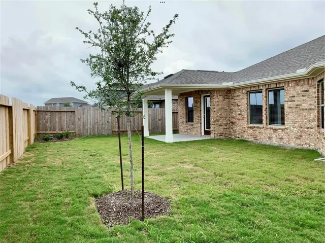 a backyard of a house with lots of green space