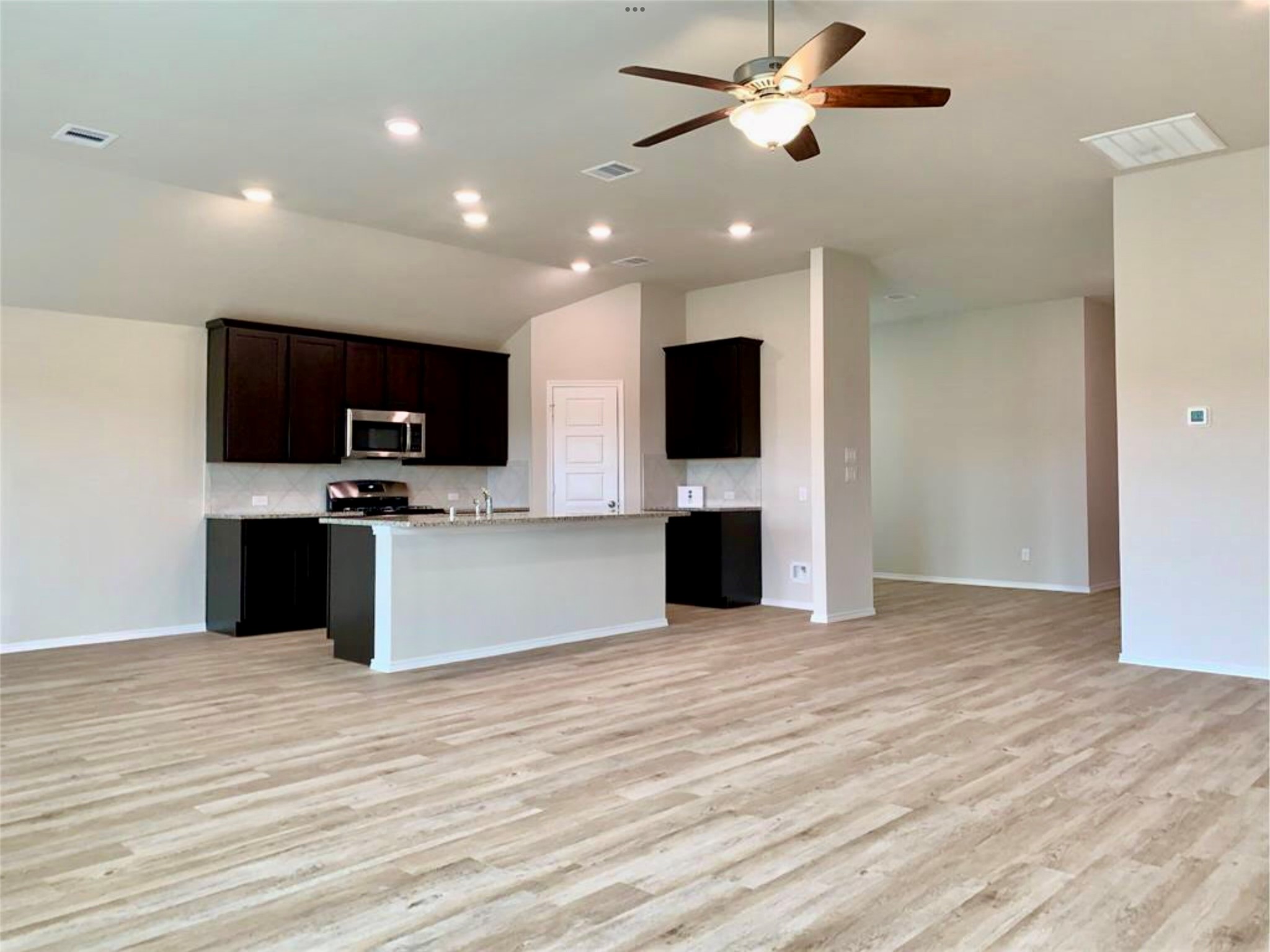 2203 Levant Lane Baytown, TX 77523 - Photo 5 of 17 a view of kitchen with microwave stove and cabinets