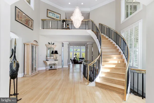 a view of entryway with wooden floor and windows