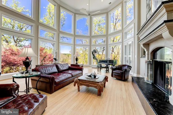 a dining room with furniture a chandelier and a rug
