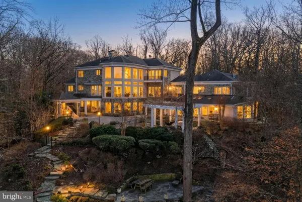 a view of a patio with table and chairs and potted plants