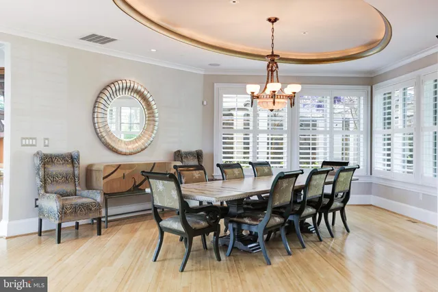 a view of a dining room with furniture and a large window