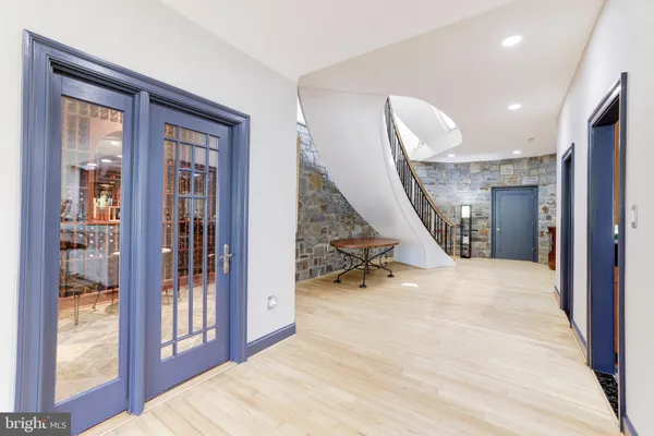 a view of kitchen with windows sink and cabinets