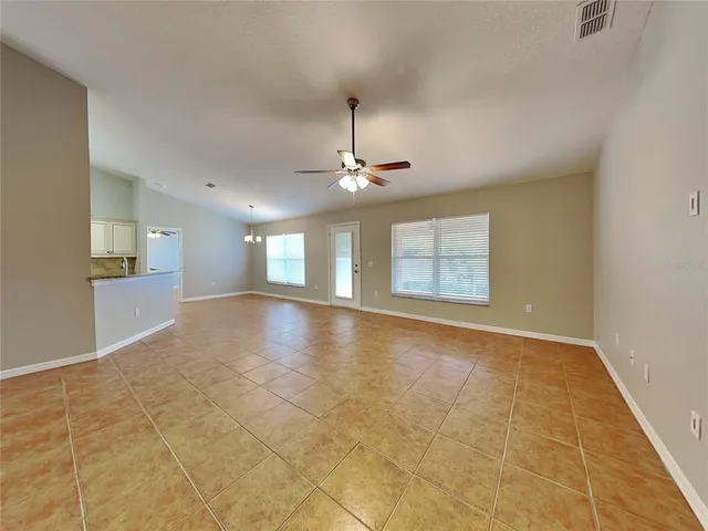 a view of an empty room with glass door