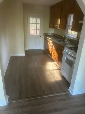 an empty room with wooden floor