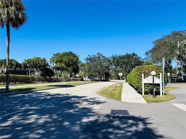 a view of a swimming pool with a yard