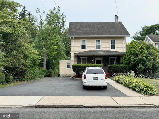 a car parked in front of a house