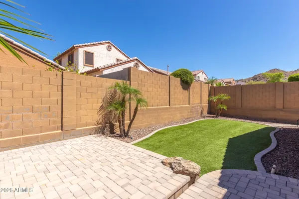 a house view with a backyard space